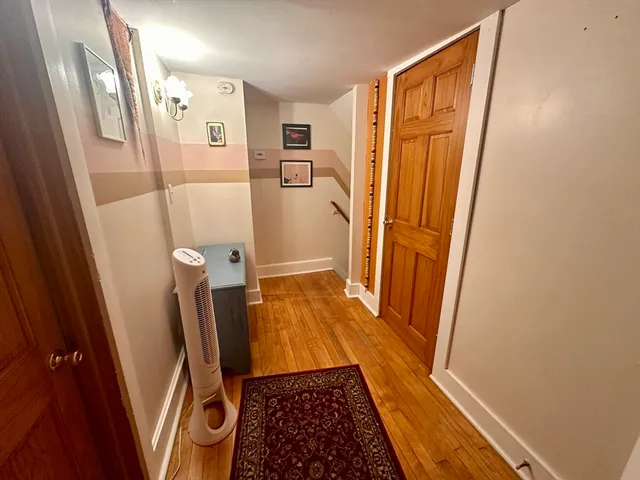 a bathroom with a toilet a sink and a mirror