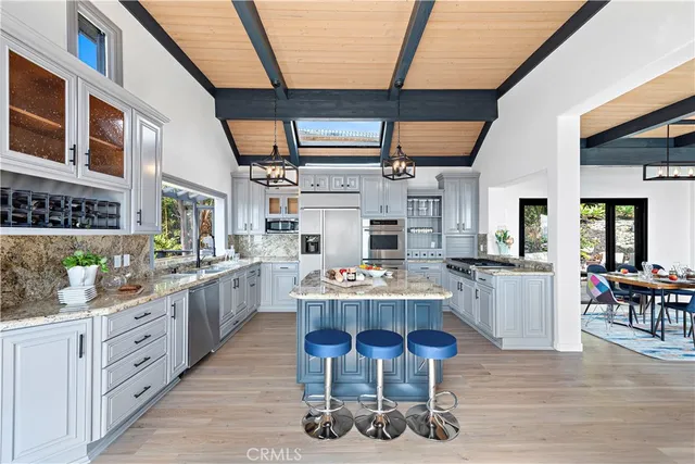 a outdoor space with lots of chairs and a chandelier