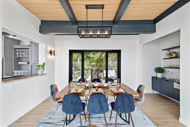 a view of a patio with table and chairs and potted plants
