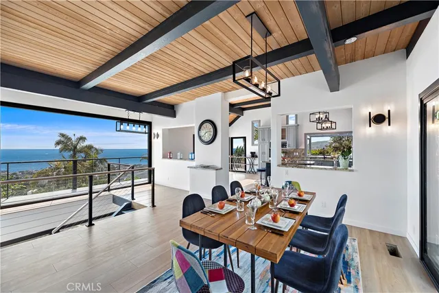 a view of a patio with table and chairs