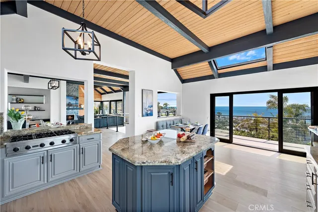 a kitchen with stainless steel appliances granite countertop a sink and cabinets