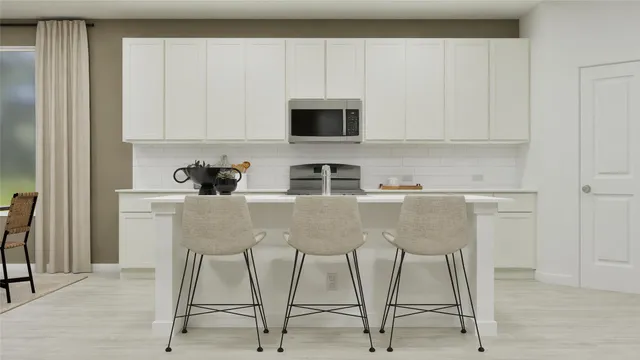 a view of a dining room with furniture and a window