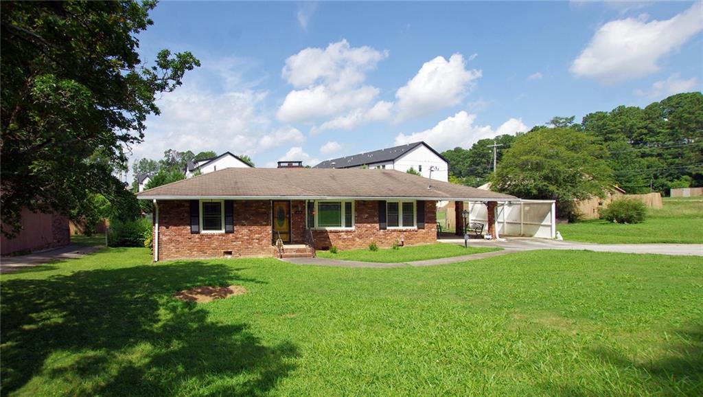 1494 Linkwood Lane Decatur, GA 30033 - Photo 1 of 1 a front view of a house with garden