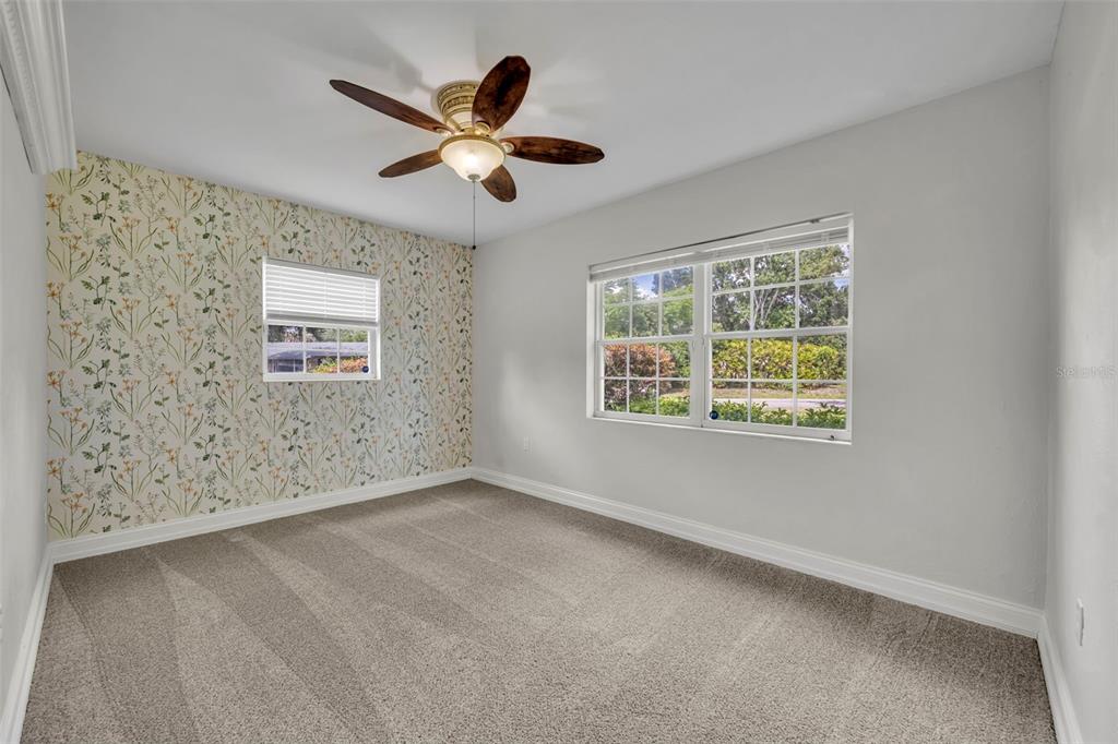 4234 Kendrick Road Orlando, FL 32804 - Photo 32 of 46 a view of a livingroom with a ceiling fan and window