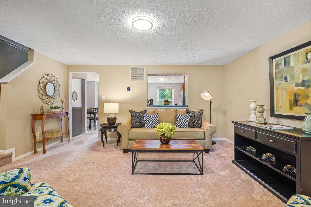 1705 Sundance Drive Reston, VA 20194 - Photo 1 of 29 a living room with furniture and a flat screen tv