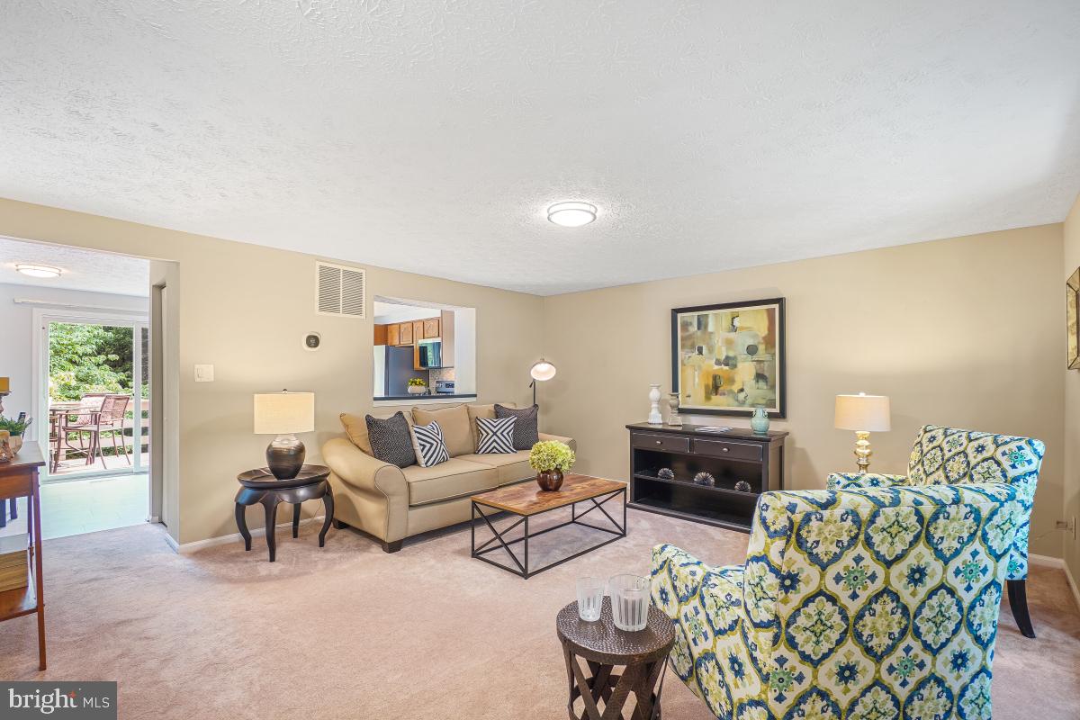 1705 Sundance Drive Reston, VA 20194 - Photo 6 of 29 a living room with furniture and a wooden floor