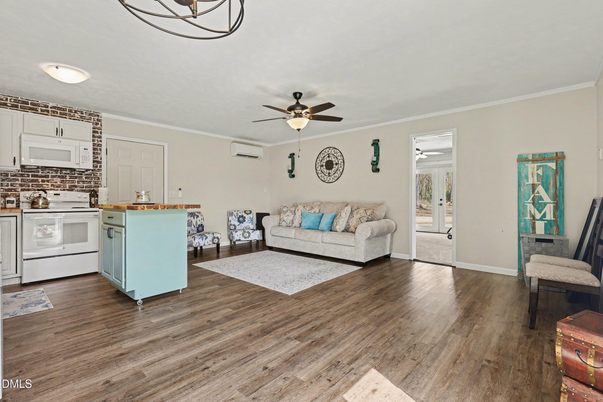 430 Fred Hall Road Stedman, NC 28391 - Photo 54 of 63 a living room with furniture and a wooden floor