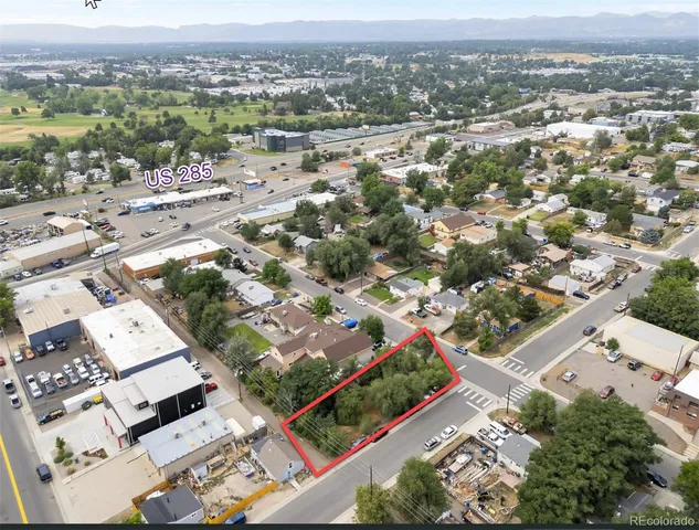 an aerial view of residential houses with city view