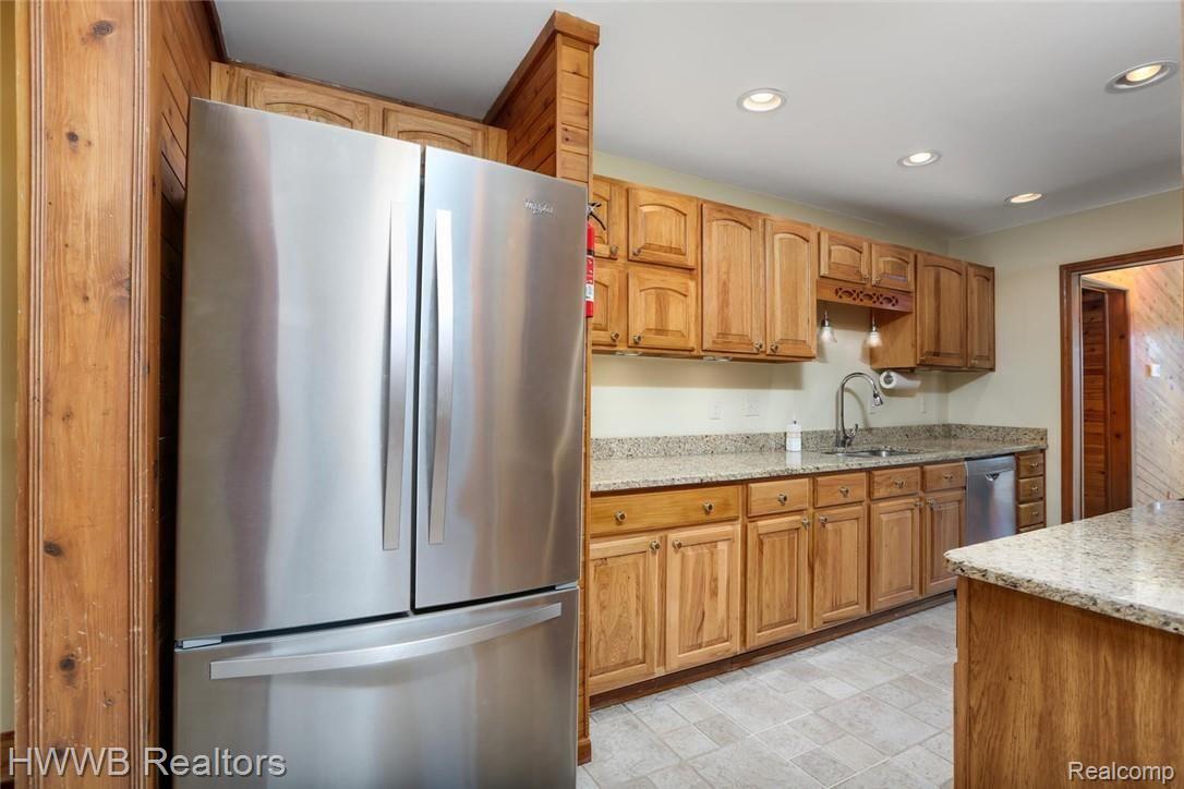 6200 Mack Road Howell, MI 48855 - Photo 15 of 52 Large stainless steel refrigerator and plenty of counter space.