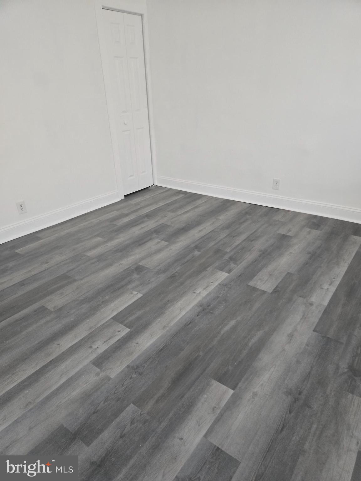 1304 Fanshawe Street Philadelphia, PA 19111 - Photo 21 of 49 a view of an empty room with wooden floor