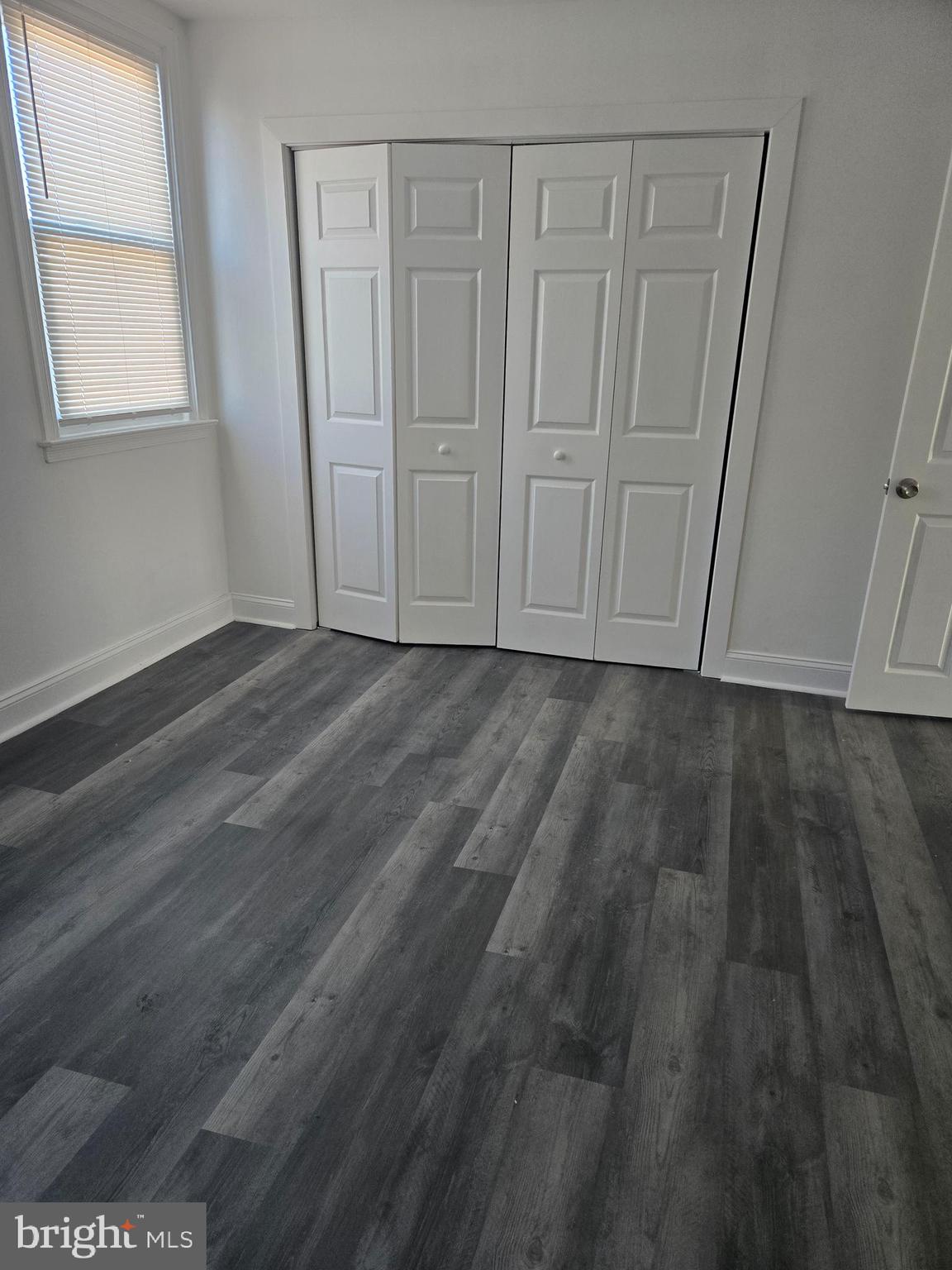 1304 Fanshawe Street Philadelphia, PA 19111 - Photo 23 of 49 a view of an empty room with wooden floor and a window