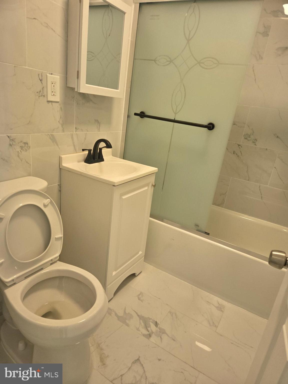 1304 Fanshawe Street Philadelphia, PA 19111 - Photo 30 of 49 a bathroom with a toilet and a sink