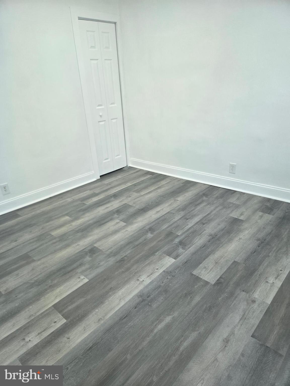 1304 Fanshawe Street Philadelphia, PA 19111 - Photo 34 of 49 an empty room with wooden floor