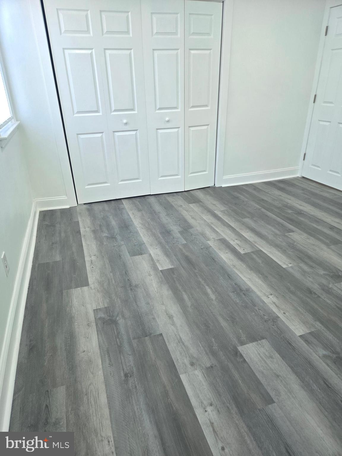 1304 Fanshawe Street Philadelphia, PA 19111 - Photo 35 of 49 a view of an empty room with wooden floor