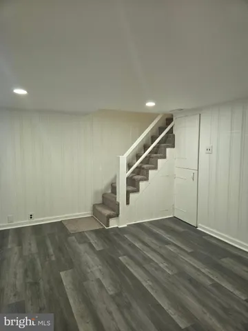 a white toilet sitting next to a white sink