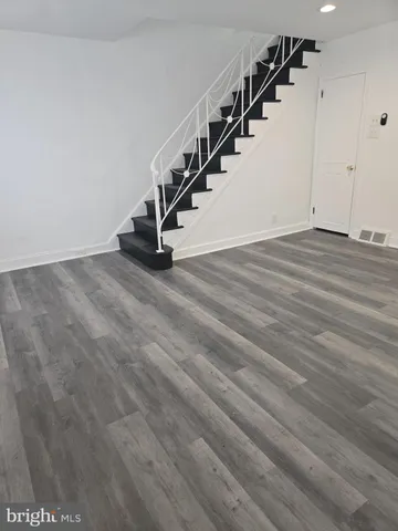 a kitchen with stainless steel appliances granite countertop a stove and a microwave