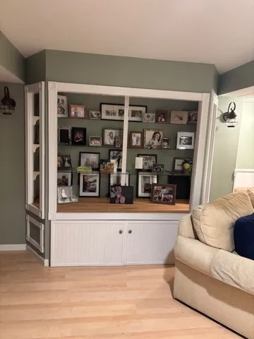 a view of a house with a bench in patio