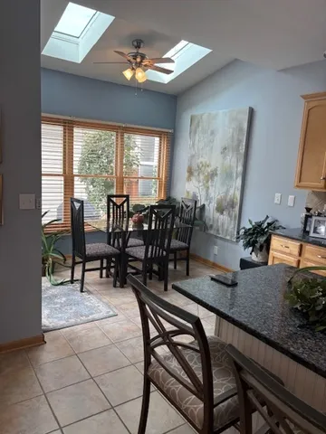 a living room with furniture a rug and a chandelier