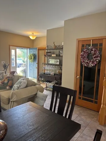 a bedroom with a bed and lamp on the dresser