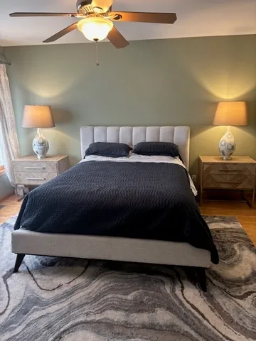 a bedroom with a bed and window