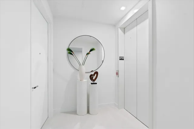 a bathroom with a mirror and a shower
