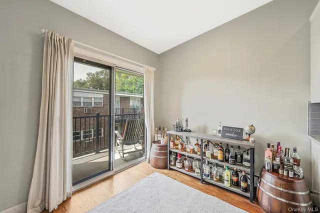 a room with lots of furniture and a large window