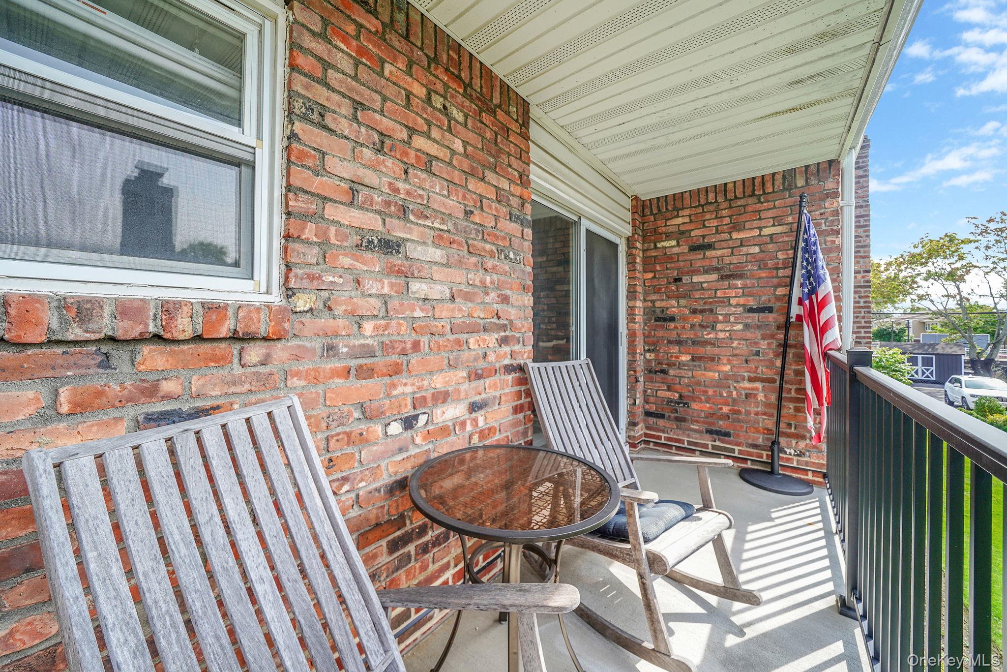 22 Ivy Street, Unit 6B Farmingdale, NY 11735 - Photo 23 of 26 a balcony view with a seating space