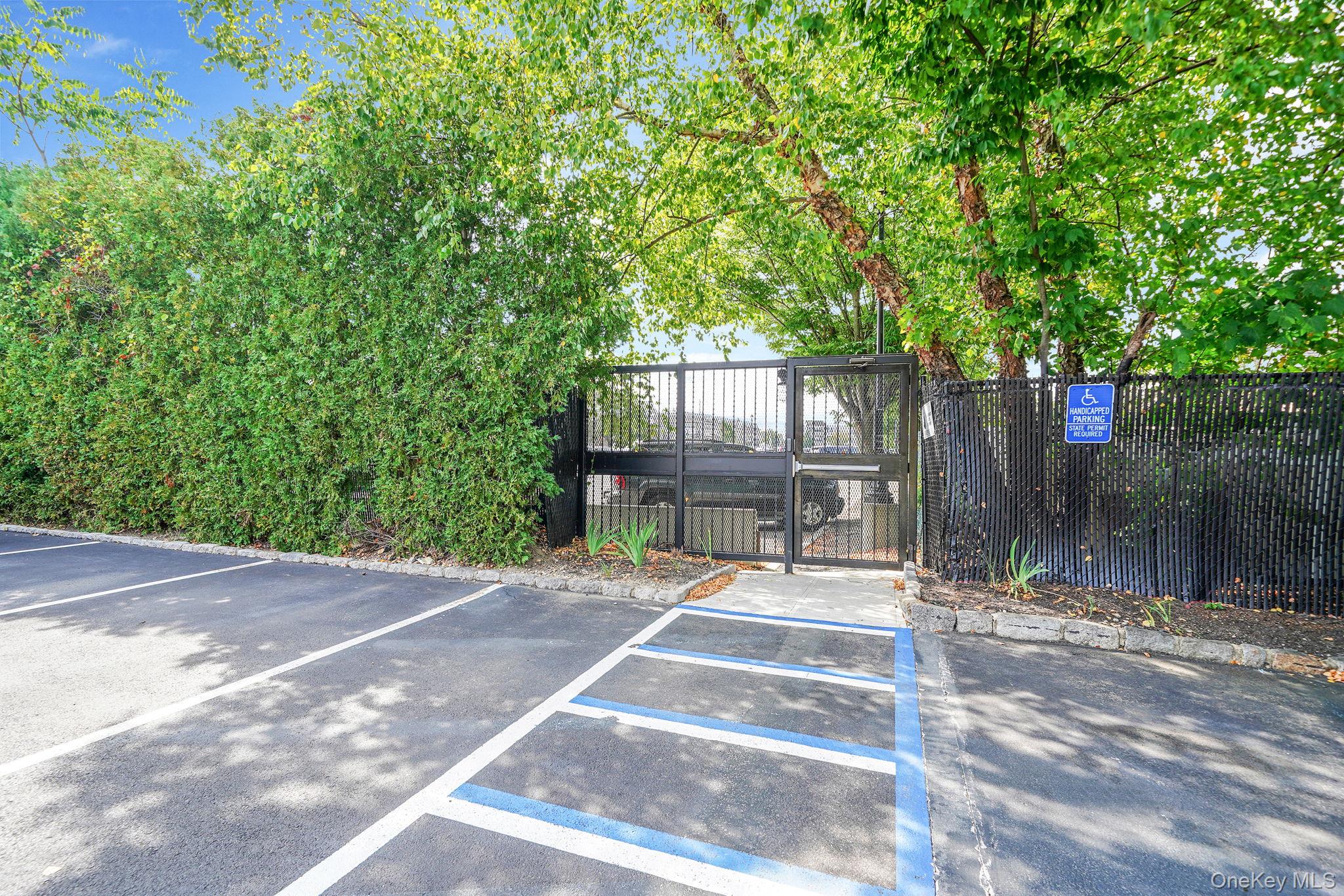 22 Ivy Street, Unit 6B Farmingdale, NY 11735 - Photo 25 of 26 a house with trees in front of it