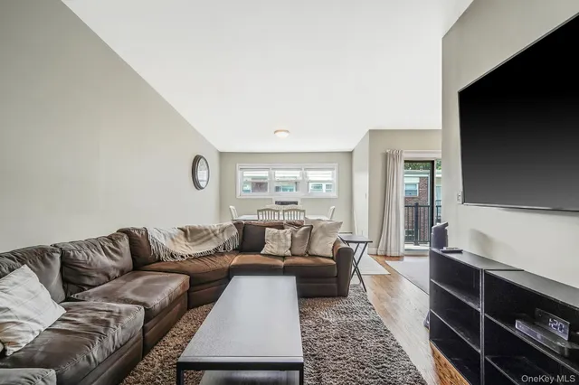 a living room with a couch and a flat screen tv
