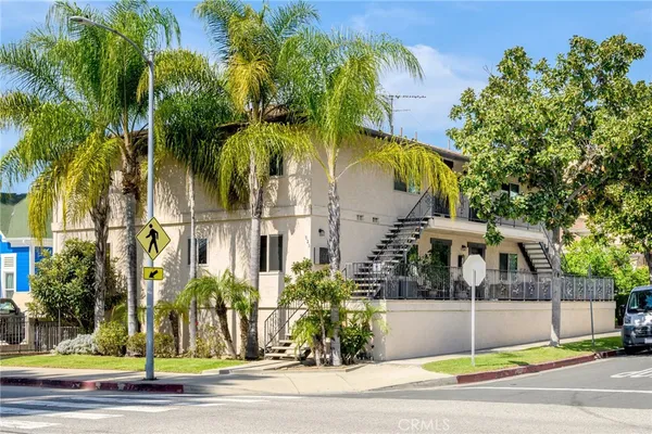 a view of a city with palm trees