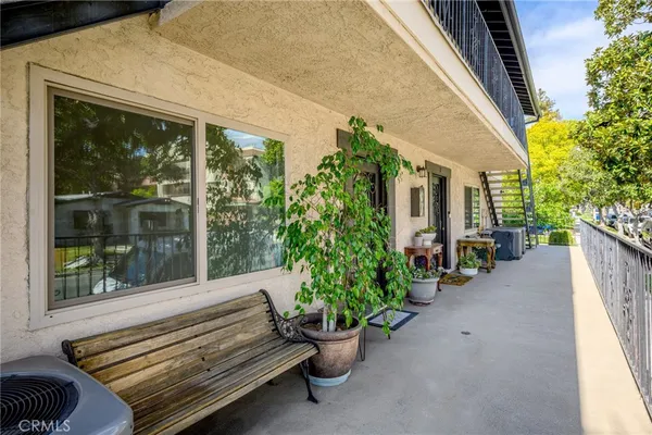 a view of a bench in front of a house