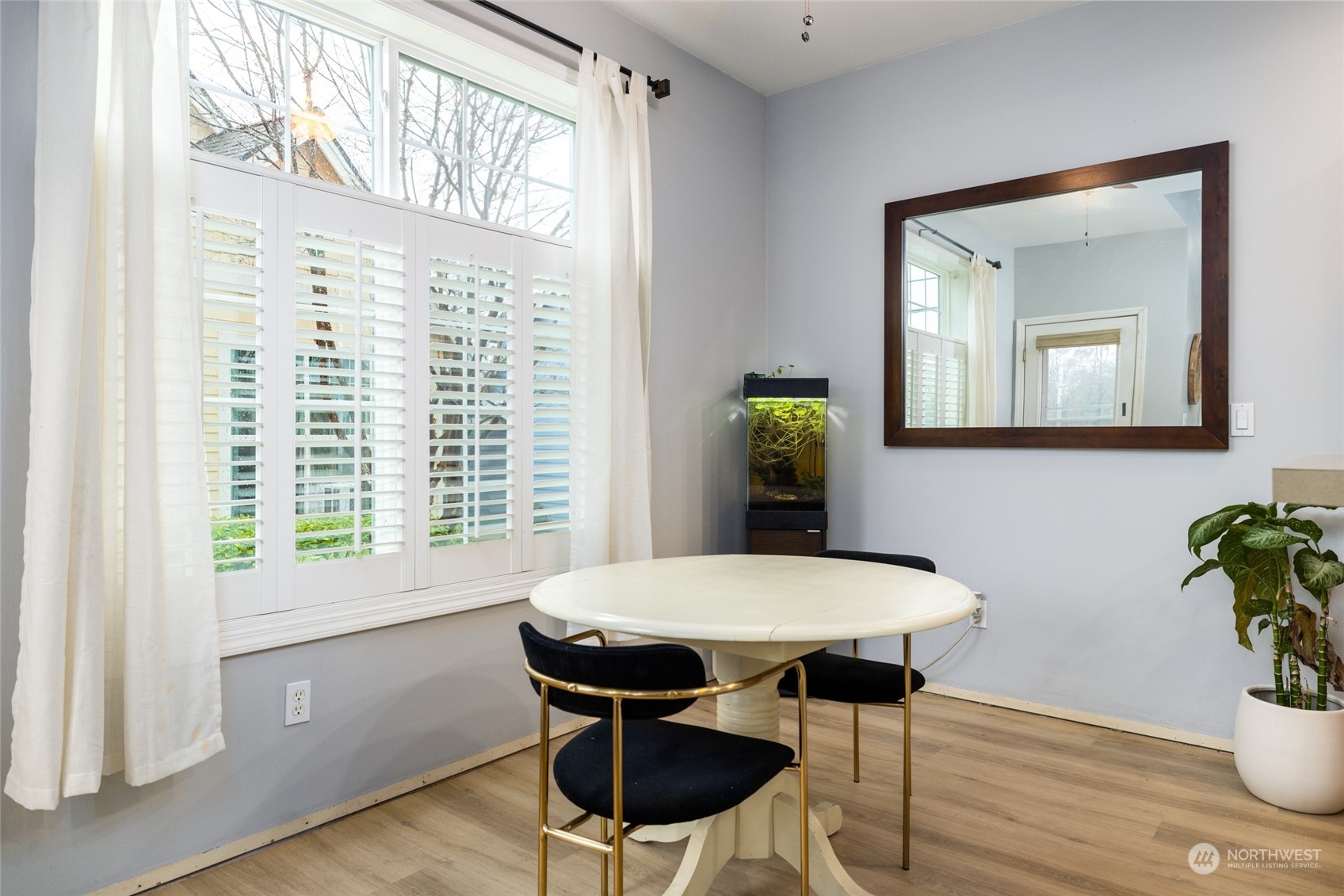 1505 Wildflower Way Sedro-Woolley, WA 98284 - Photo 18 of 24 a view of a dining room with furniture and wooden floor