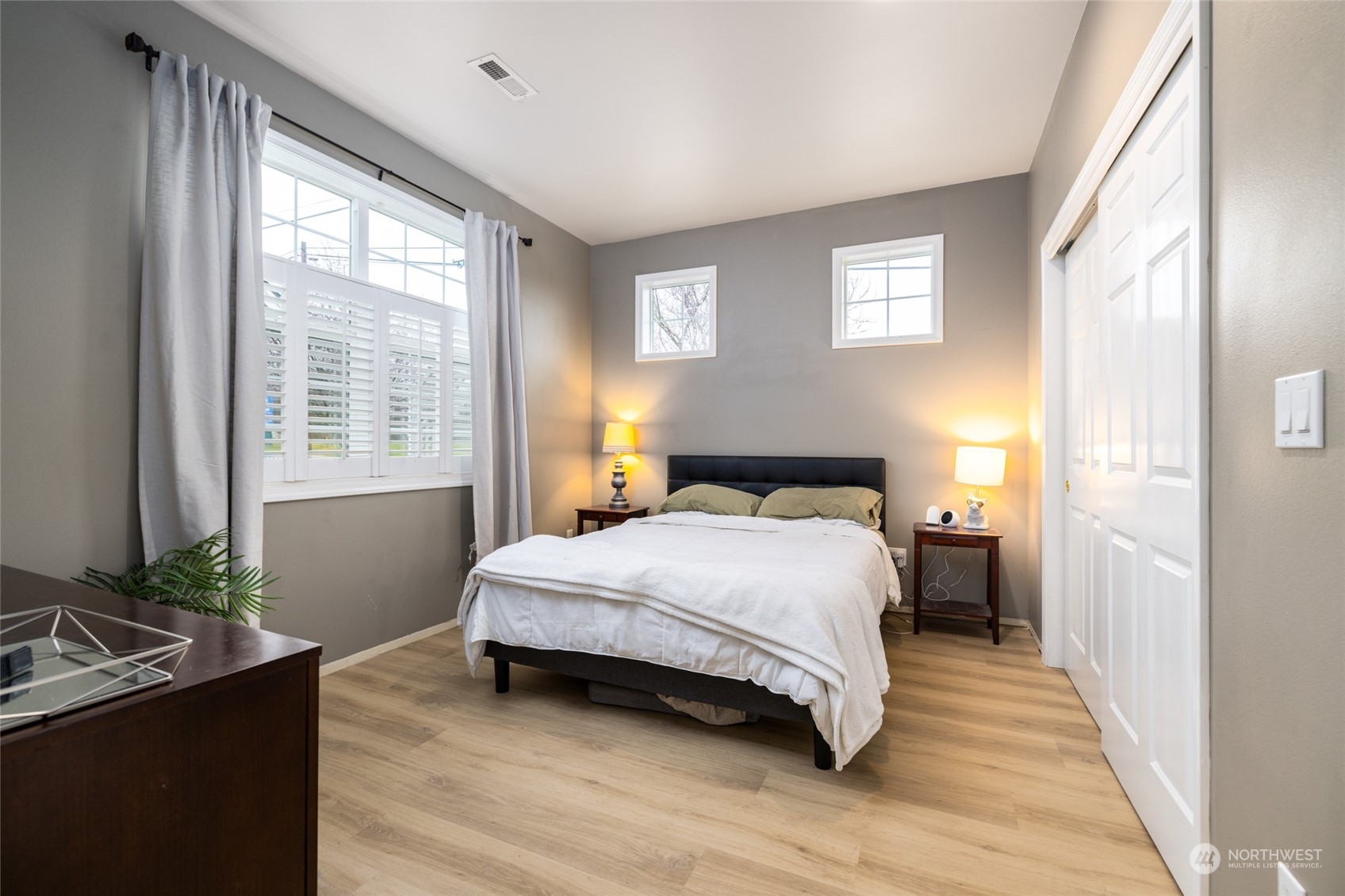 1505 Wildflower Way Sedro-Woolley, WA 98284 - Photo 4 of 24 a bedroom with a bed table closet and a window