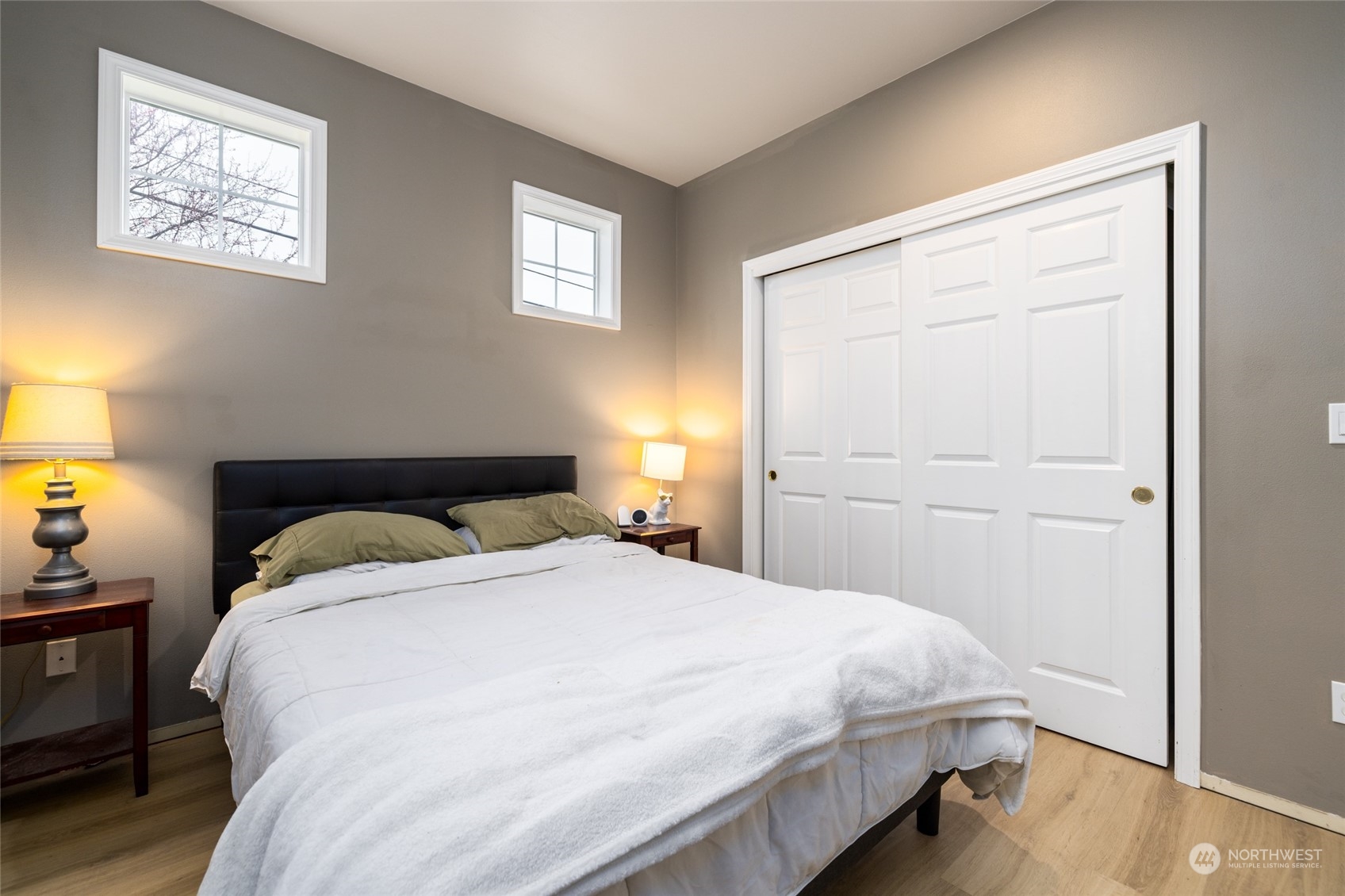 1505 Wildflower Way Sedro-Woolley, WA 98284 - Photo 5 of 24 a bedroom with a bed and a window