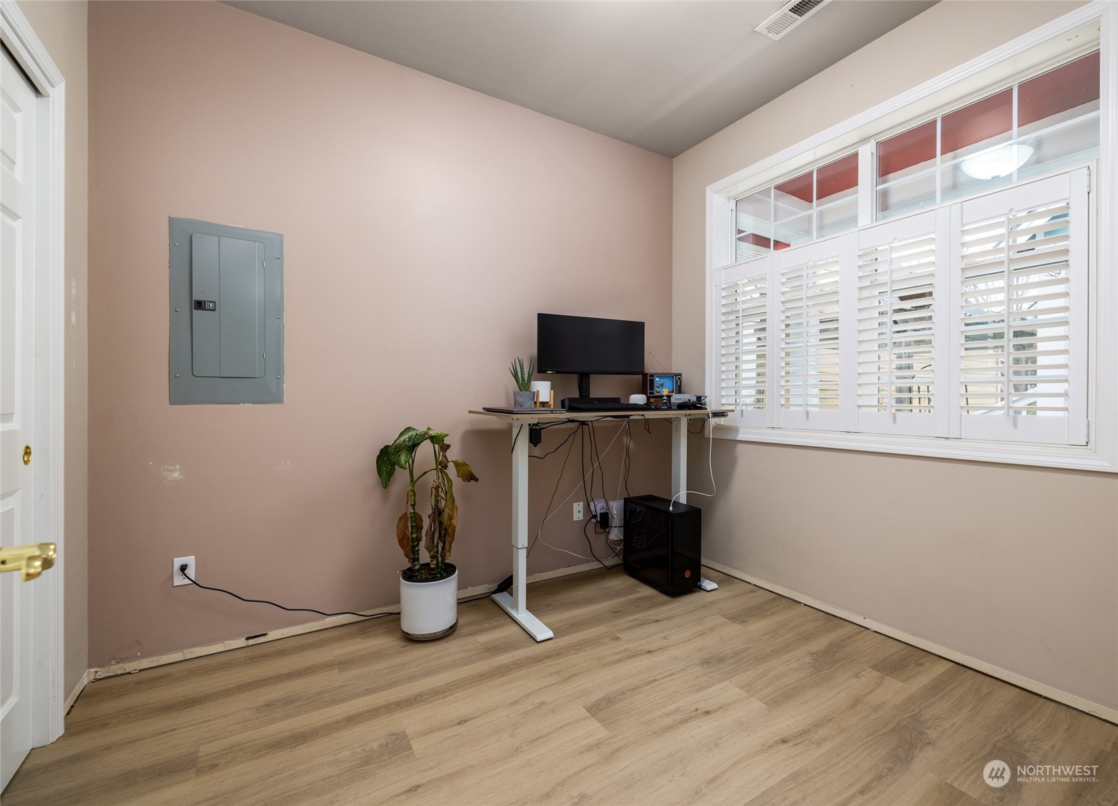 1505 Wildflower Way Sedro-Woolley, WA 98284 - Photo 6 of 24 a view of workspace with wooden floor windows cabinet and flat screen tv