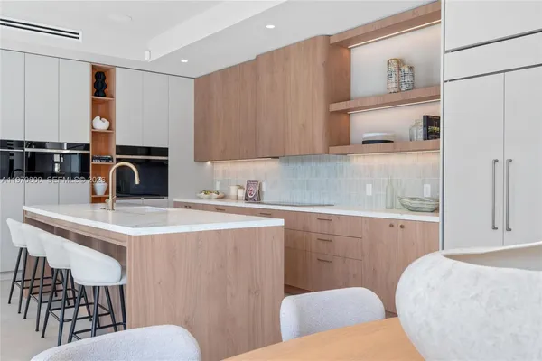 a kitchen with a sink cabinets and window