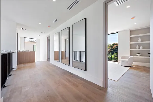 a view of a big room with closet and windows