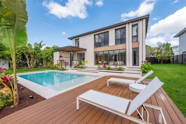 a view of a patio with swimming pool