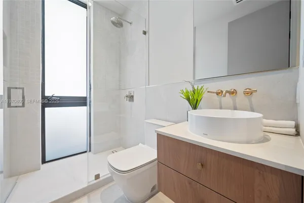 a bathroom with a sink and toilet