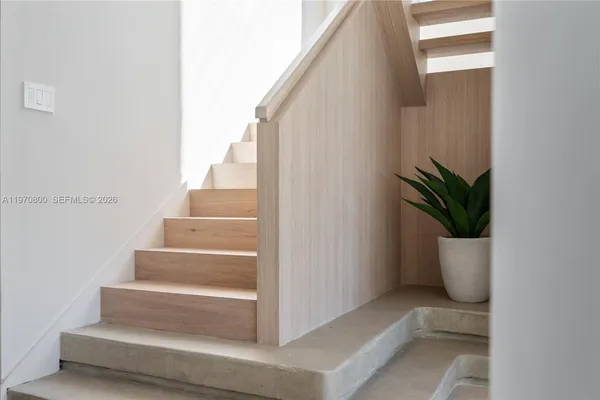 a view of staircase with white walls