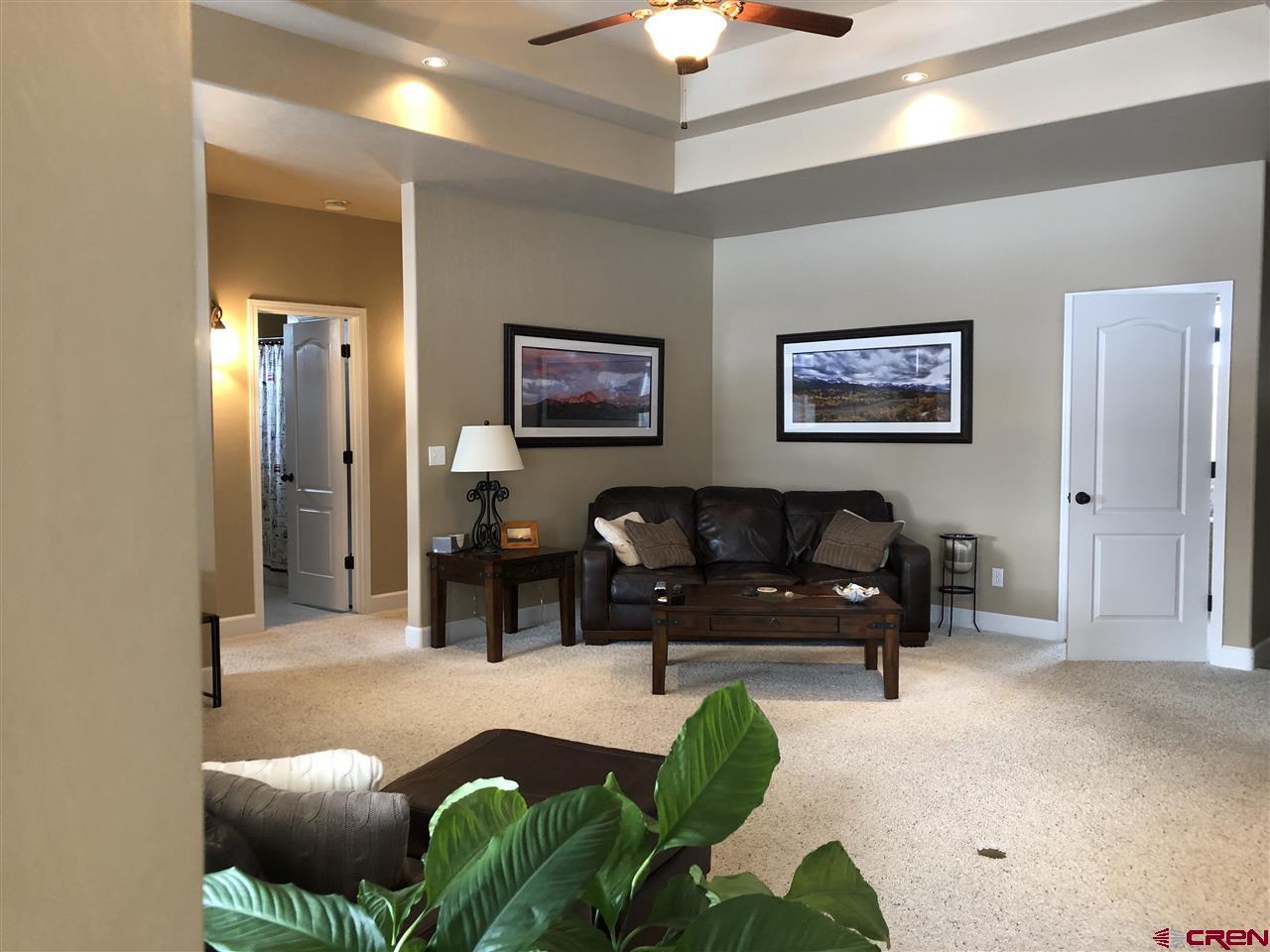 3016 Outlook Road Montrose, CO 81401 - Photo 6 of 30 white door next to couch is the door into the office