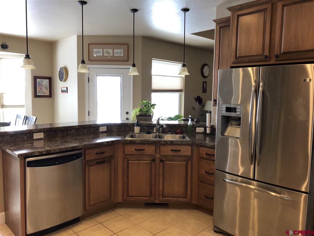 3016 Outlook Road Montrose, CO 81401 - Photo 9 of 30 Beautiful tile floors in kitchen and dining areas.