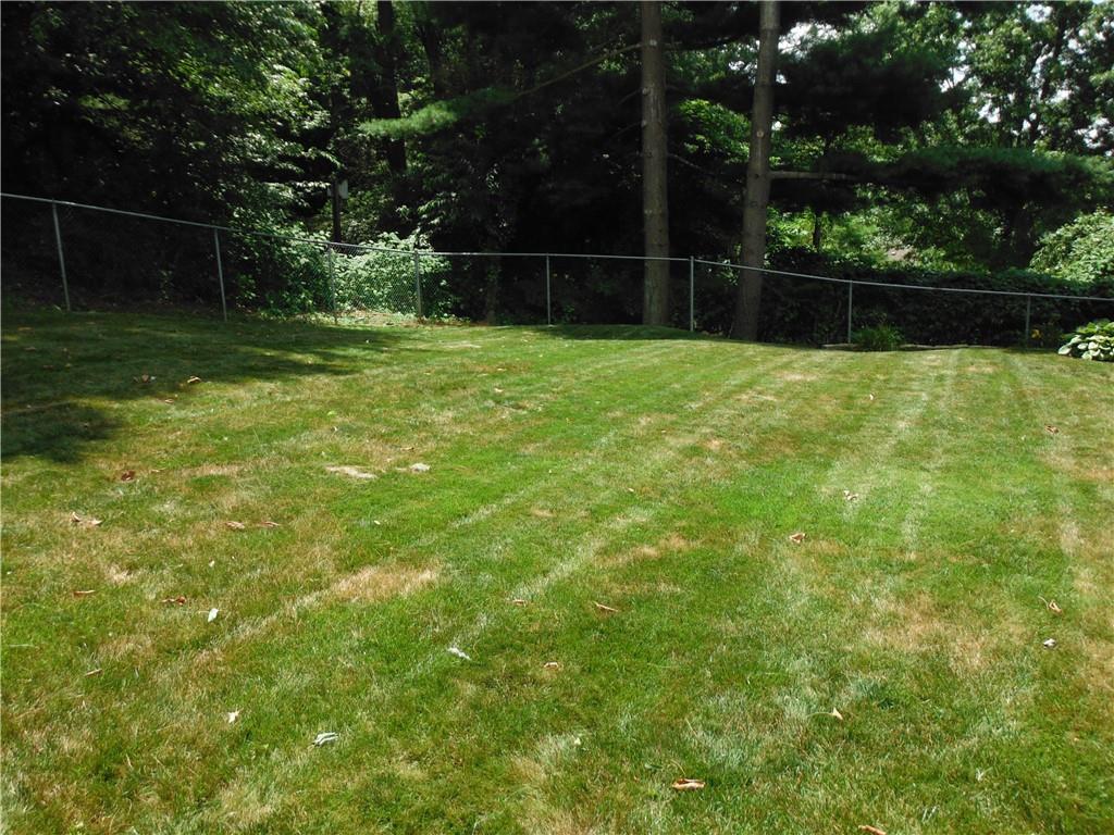 126 Oakglen Road Pittsburgh, PA 15237 - Photo 8 of 32 a view of a backyard with a small cabin