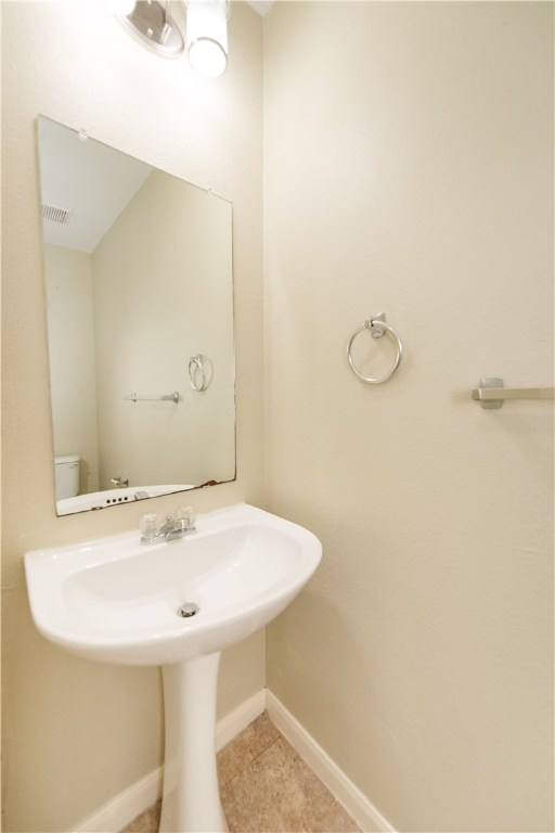 9710 Sugar Hill Drive, Unit A Austin, TX 78748 - Photo 15 of 40 a bathroom with a sink and a mirror
