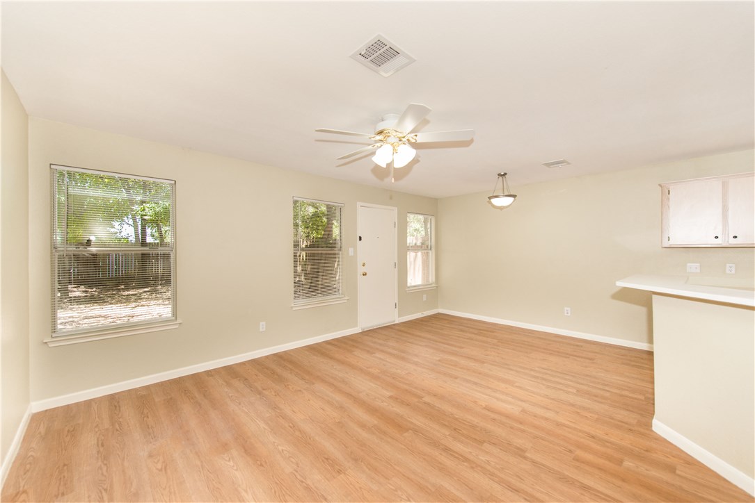 9710 Sugar Hill Drive, Unit A Austin, TX 78748 - Photo 17 of 40 a view of an empty room with a window and a kitchen
