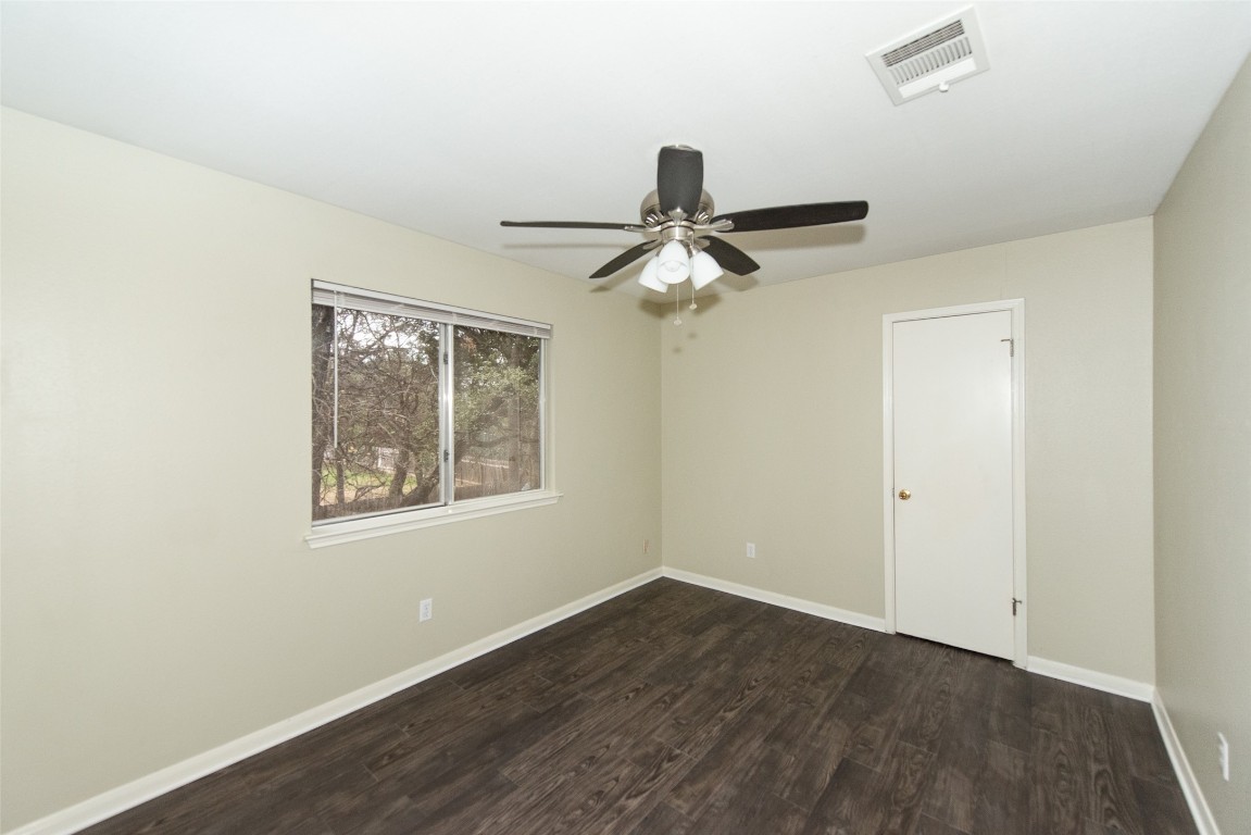 9710 Sugar Hill Drive, Unit A Austin, TX 78748 - Photo 23 of 40 a view of a room with a ceiling fan and a window