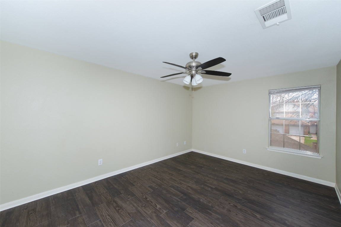 9710 Sugar Hill Drive, Unit A Austin, TX 78748 - Photo 26 of 40 wooden floor in an empty room with a window