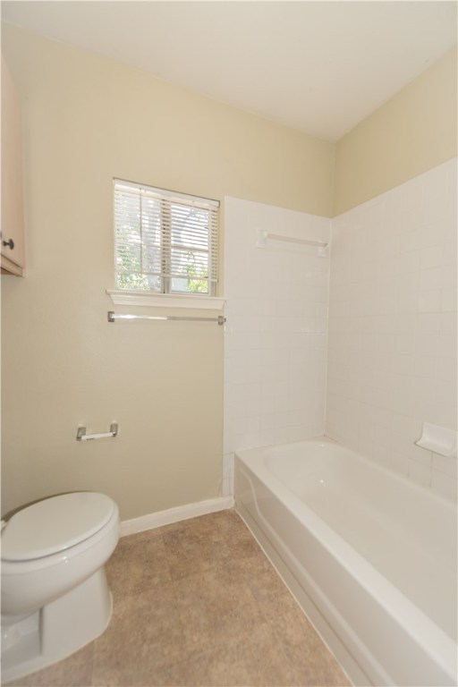 9710 Sugar Hill Drive, Unit A Austin, TX 78748 - Photo 29 of 40 a white bath tub sitting next to a toilet