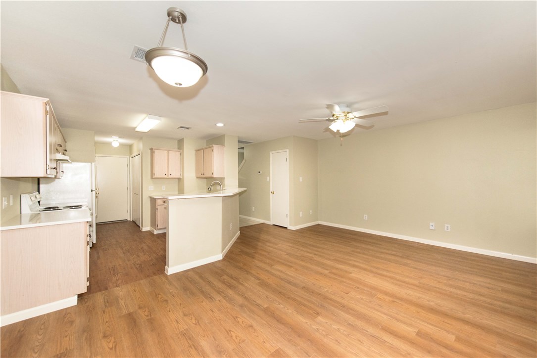 9710 Sugar Hill Drive, Unit A Austin, TX 78748 - Photo 3 of 40 a view of a kitchen with a sink and a refrigerator
