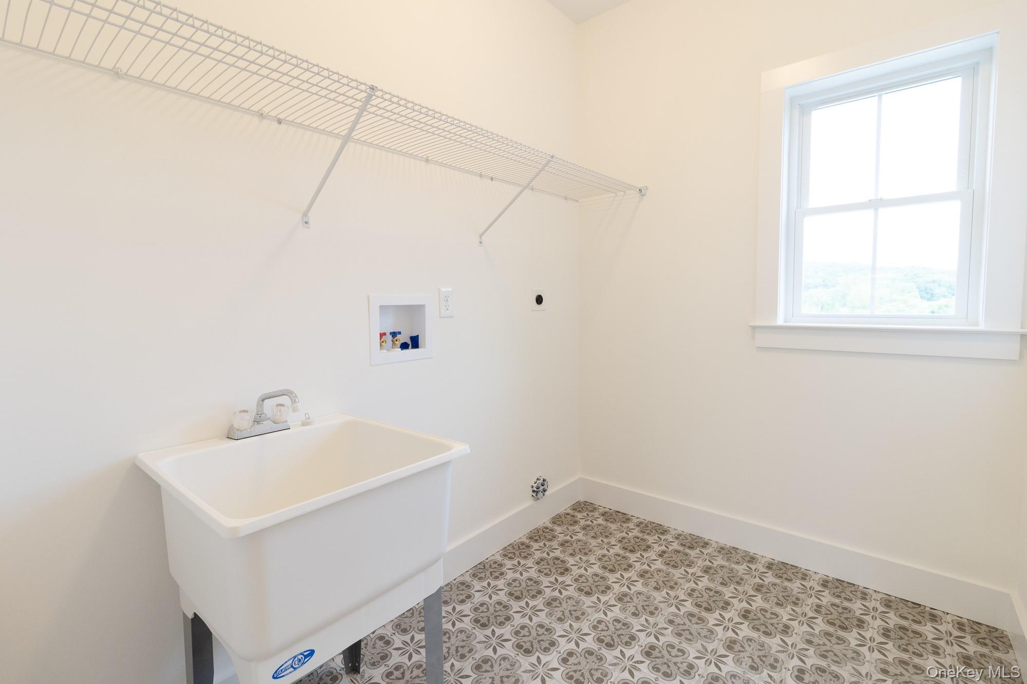 750 Ridgebury Road Slate Hill, NY 10973 - Photo 16 of 41 a bathroom with a sink a window and vanity